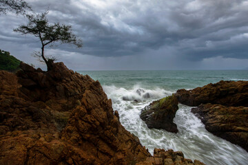 Sea wave hit the rock Beach sunset, Beautiful natural summer seascape ,Phuket, Thailand .