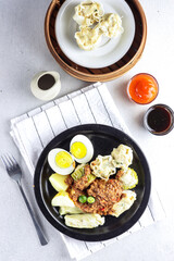 Siomay a dumpling traditional Indonesian food with peanut sauce. 
