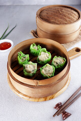 Steamed dumpling dimsum in bamboo steamer. 