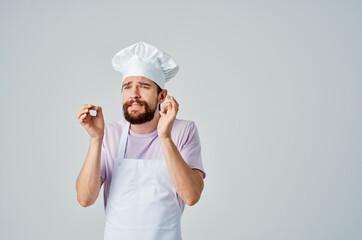 Cheerful bearded man gesturing with hands cooking food preparation restaurant industry