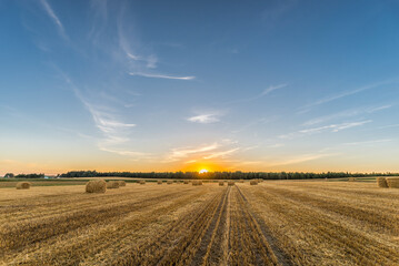 An image of sunset over harvest fields in Belarus