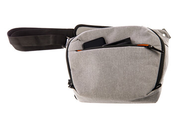 Isolated close up studio shot of small photographer modern fashionable gray shockproof waist bag...