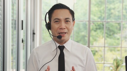 Video call camera view of businessman talks actively in videoconference . Call center,...