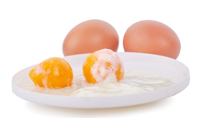 Two soft boiled eggs in the white bowl