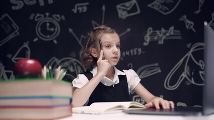 Teen school student studying with laptop books doing online research homework assignment, white Caucasian teenage girl using computer and writing something in notebook - Powered by Adobe