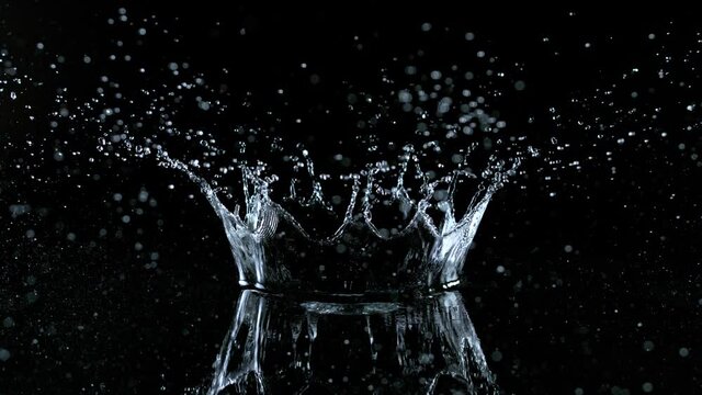 Super Slow Motion Shot of Water Crown Splash at 1000fps Isolated on Black Background.