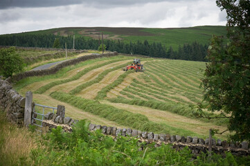 Fototapeta na wymiar tractor working in a field in North Yorkshire