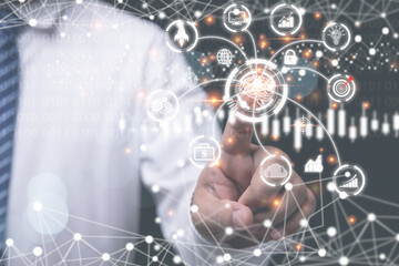 A businessman use finger pushing button touch screen internet online in the future. Presentation idea innovation by use internet online network. Concept Business, technology, social media.