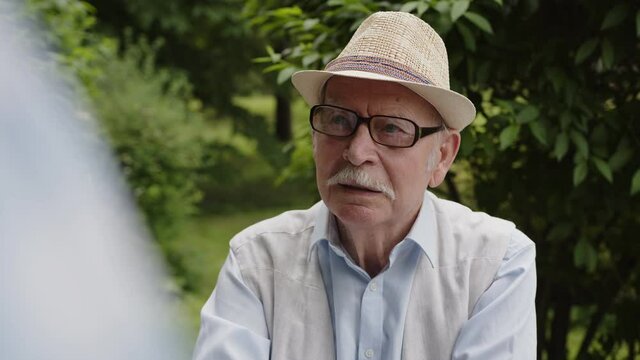 An old cheerful man tells the story of his life