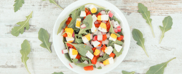 Fresh prepared salad in glass bowl, healthy nutrition concept