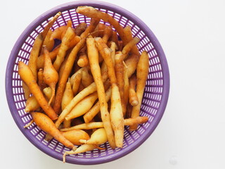 Kaempferia or Chinese Ginger in a basket on white background
