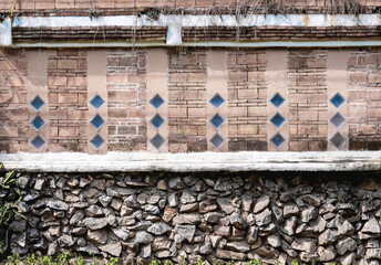 Vintage brick wall with space and decorative stone on concrete background