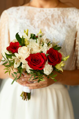 a bouquet of flowers in the hands of the bride