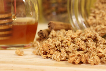 Organic Honey on Dipper With Granola and Cinnamon