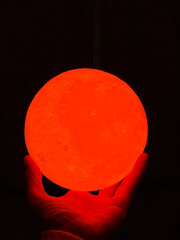 red light bulb on dark background