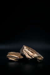 gold catwalks for cosmetics on a black background