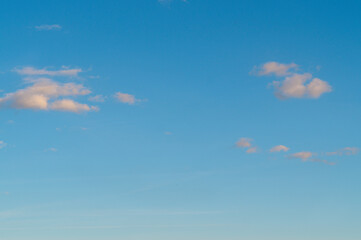 beautiful, voluminous, airy, small clouds in a blue sky