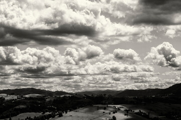 photo in retro style. landscape of sky and mountains, black and white photo, graininess. High...