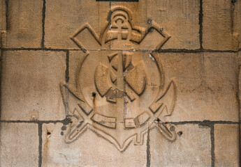 Shield sculpted with marine objects in San Sebastian, Donostia, Basque Country, Spain.