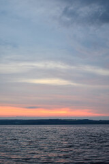 Evening cloudy horizon illuminated by sunset