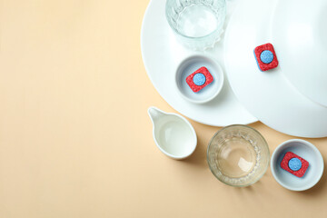 Concept of Dishwashing detergent accessories on beige background