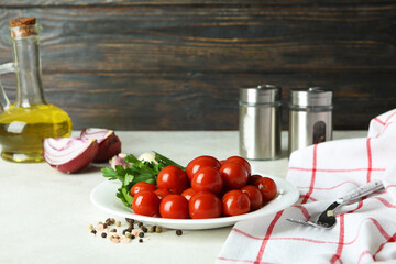 Concept of pickled vegetables with tomatoes on white textured table