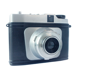 Old camera on a white background half-sided with an open lens