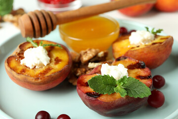 Plate with tasty grilled peach, close up