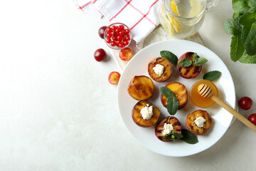 Naklejka na ściany i meble Concept of tasty food with plate with grilled peach