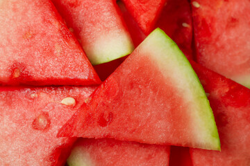 Ripe juicy watermelon slices all over background