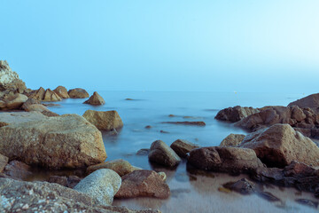 Fototapeta na wymiar rocks and sea evening seascape photo