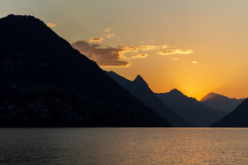 Panoramic view at sunrise time with hills on the lake Lugano, Paradiso, Switzerland