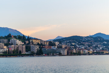 Fototapeta premium Lake promenade City of Lugano with sunrise sky, Travel in Switzerland
