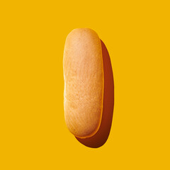 Bread loaf on yellow pastel background