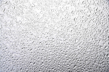 Water drops on silver plate background