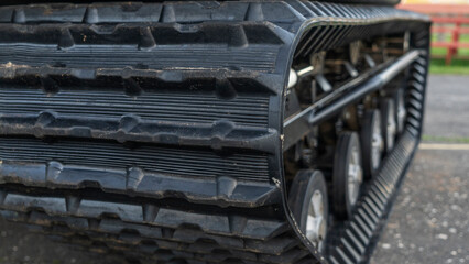 The wheels and track of a small all-terrain vehicle. Tracks of all-terrain cross-country vehicle. Adventure concept.