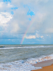 rainbow over the sea - view from the beach