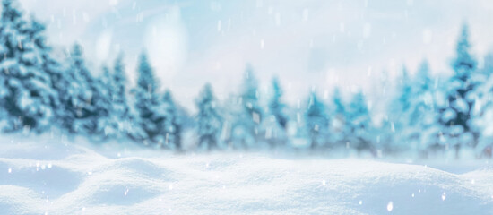 Beautiful winter background of snow and blurred forest in background, gently falling snow flakes...