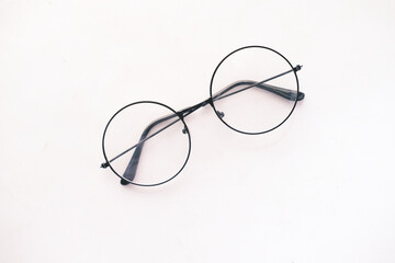 Old eyeglass on white background close up ,