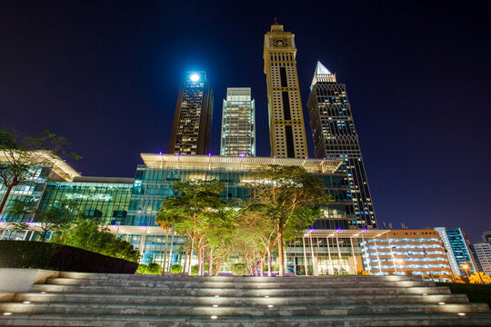 Dubai, UAE – April 18, 2021: night view on skyscrapers Hotel Grand Mercure Majlis, The Tower, Capricon Tower, Maze Tower, on side Gate Avenue