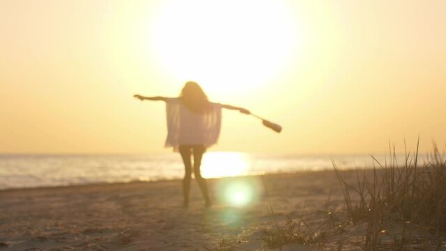 Silhouette of the Woman with Ukulele on the Beach Summer Vacation