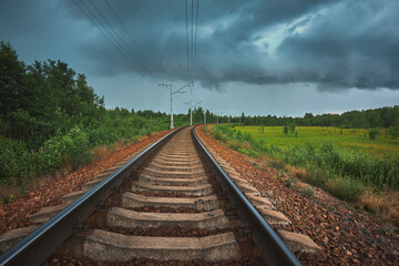 Railroad passes the Sestroretskoye swamp autumn before a thunderstorm.
