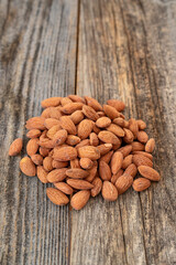 Almond nuts on wood background. Organic and fresh nuts. close up