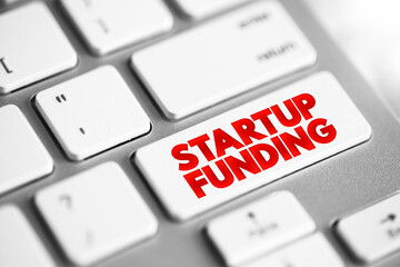 Startup Funding text button on keyboard, concept background