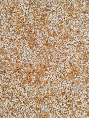 Natural gravel texture with dry leaves for background. Hard landscape in outdoor. Construction material.