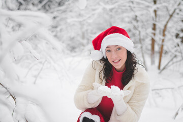 Beautiful girl in a snowy forest