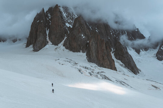 Panoramic shot of roped party traveling on glacier Valle blanche