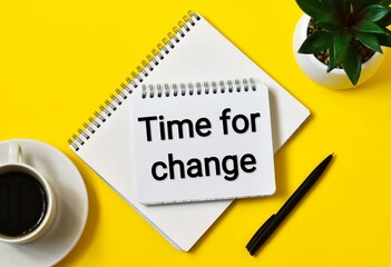 TIME FOR CHANGE text on notebook with cup coffee, green plant and pen on a yellow background. Flat lay.