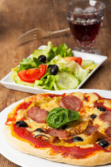 closeup of a pizza with a basil leaf