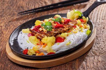 steaming hot sizzler on wood